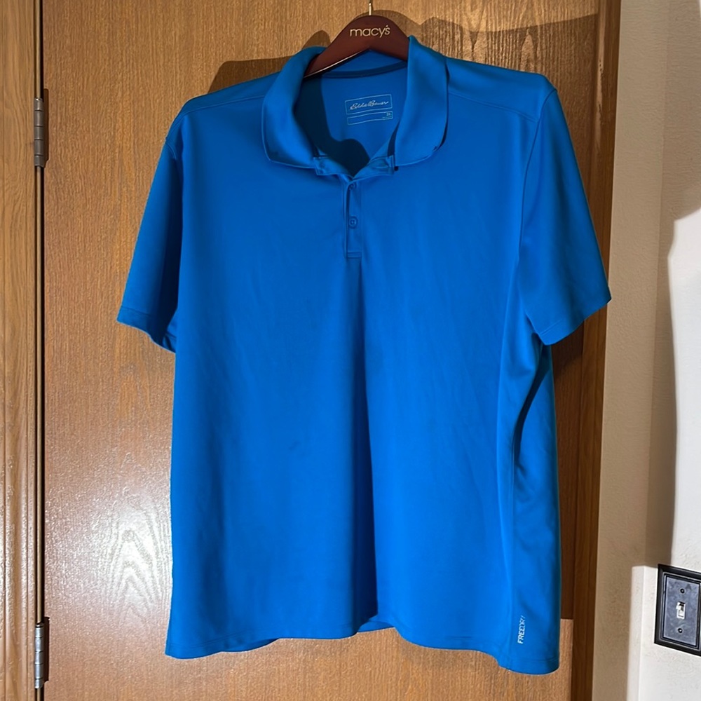 Here is a Eddie Bauer turquoise blue shirt. It’s is a 2 XL in size.